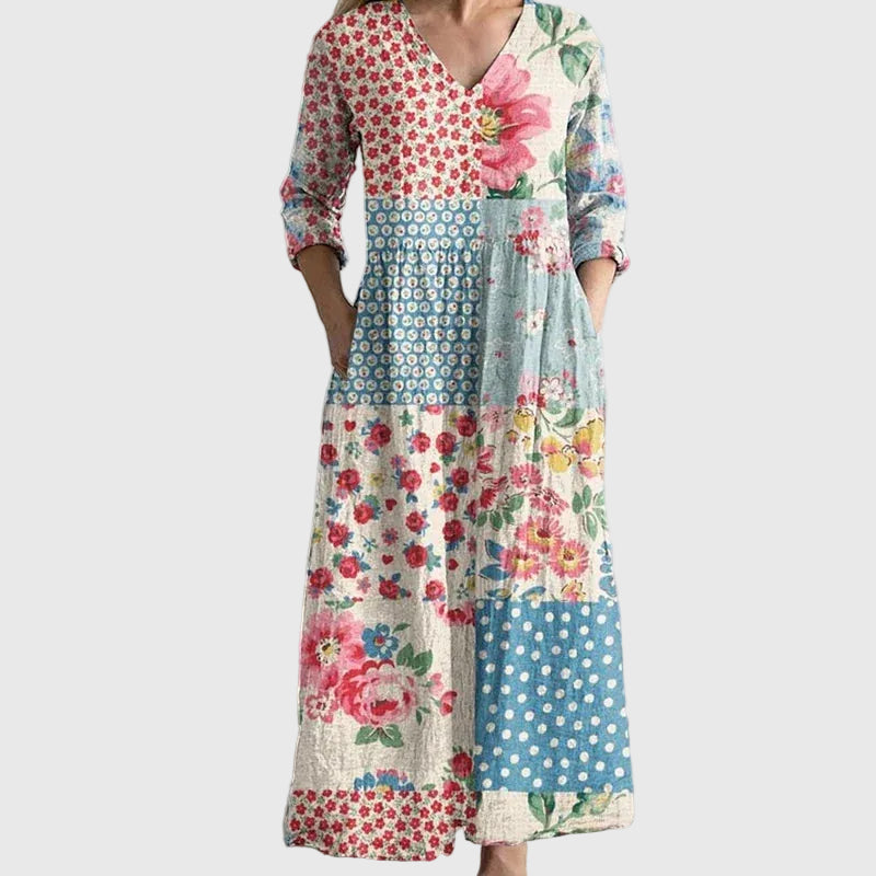 Woman wearing a long, gracefully flowing maxi dress that moves softly as she walks.
