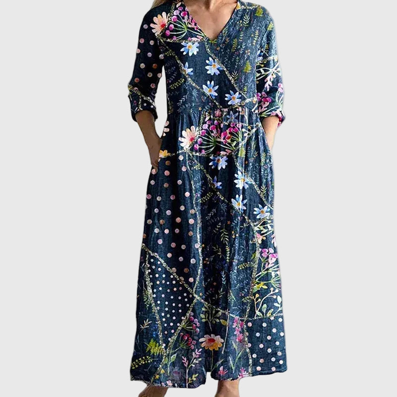 Woman wearing a long, gracefully flowing maxi dress that moves softly as she walks.