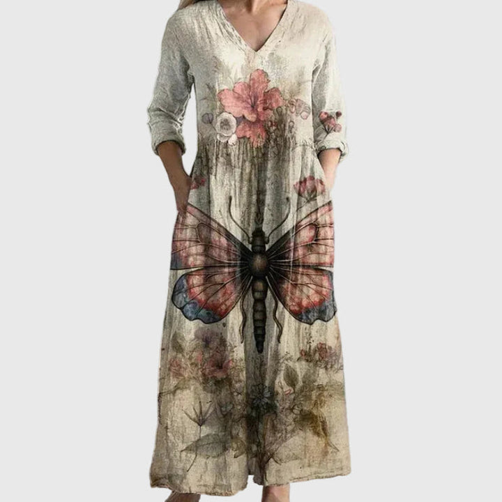 Woman wearing a long, gracefully flowing maxi dress that moves softly as she walks.