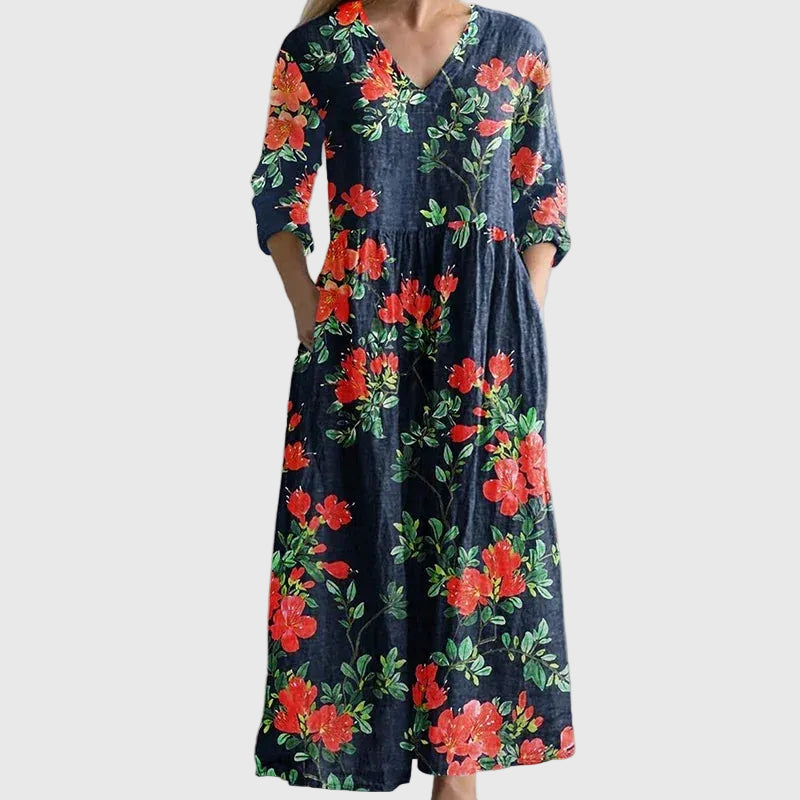 Woman wearing a long, gracefully flowing maxi dress that moves softly as she walks.