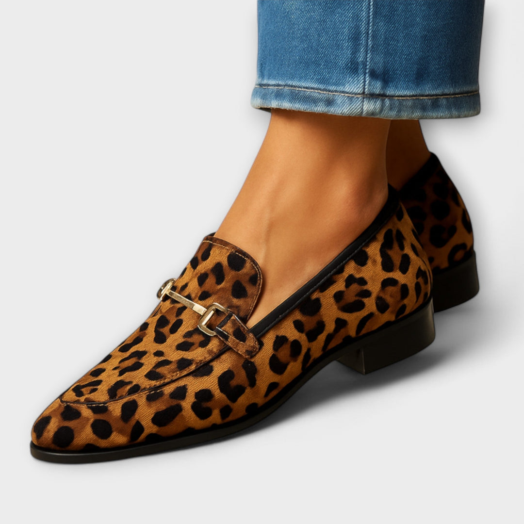 A woman wearing expressive statement loafers with a simple everyday outfit