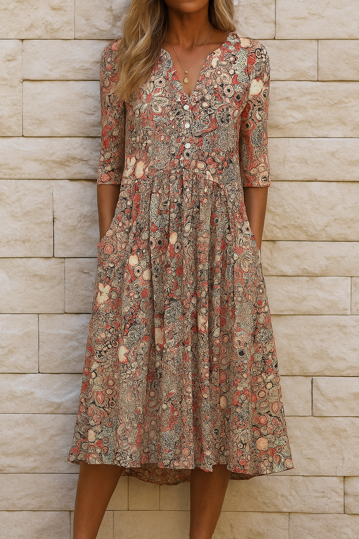 Woman wearing the Sandra elegant V-neck dress with three-quarter sleeves, walking through a city street.