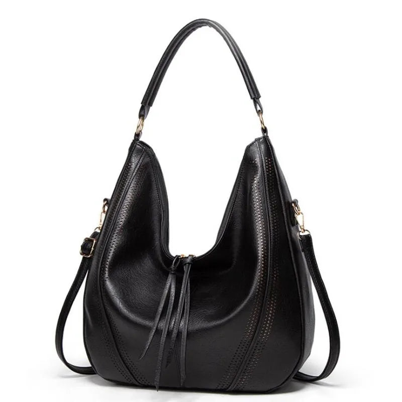 A woman holding a soft grey casual handbag over her shoulder on a relaxed day out.