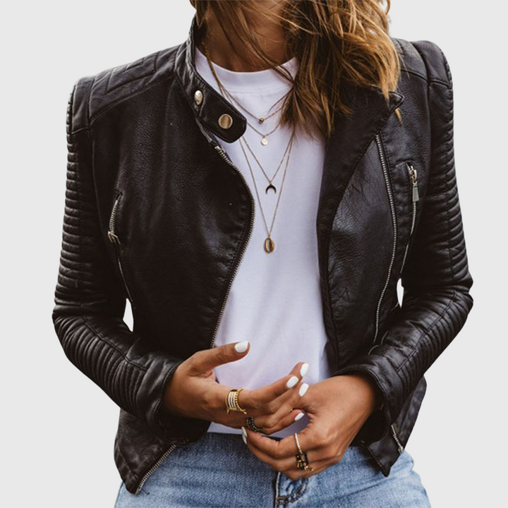 A woman wearing a classic biker jacket with a waisted cut