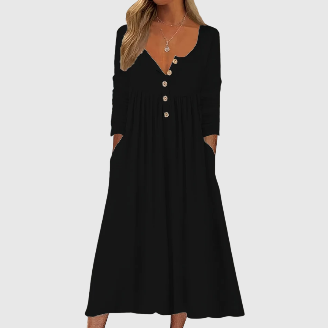A woman wearing the Tina button-front midi dress with an A-line skirt, dressed for a casual day out.