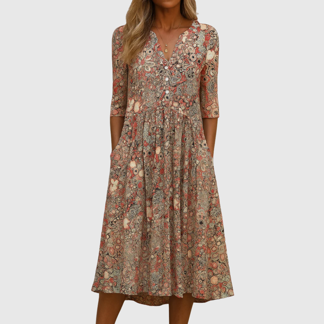 Woman wearing the Sandra elegant V-neck dress with three-quarter sleeves, walking through a city street.