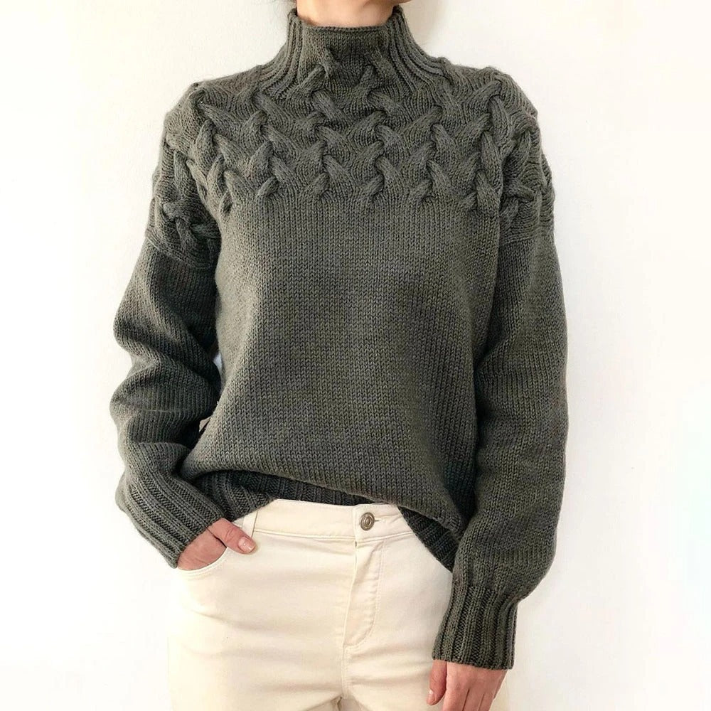 A woman wearing a warm roll-neck sweater, cosy and elegant on a cold winter day.