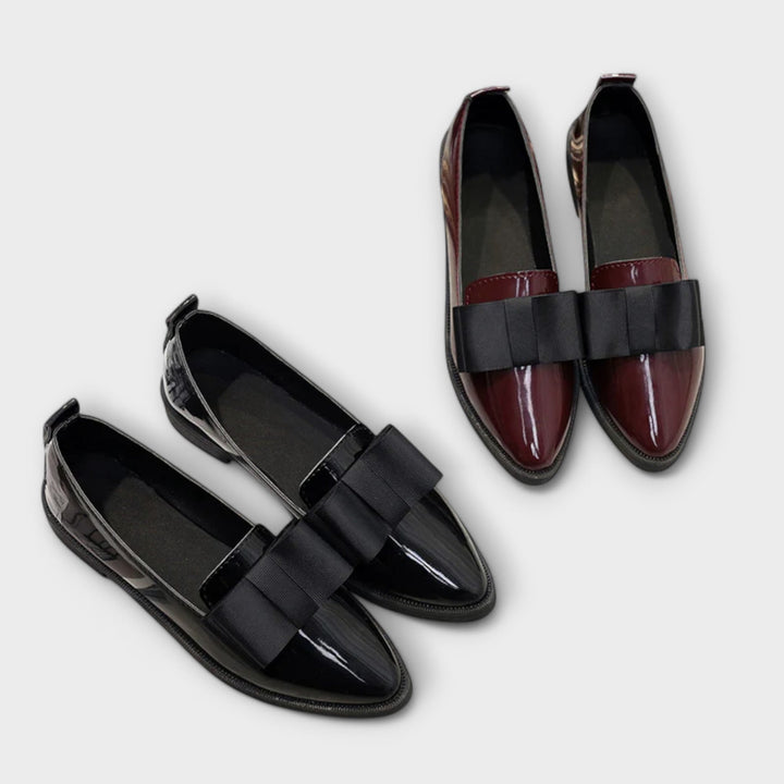 A woman wearing refined classic loafers with a smart everyday outfit