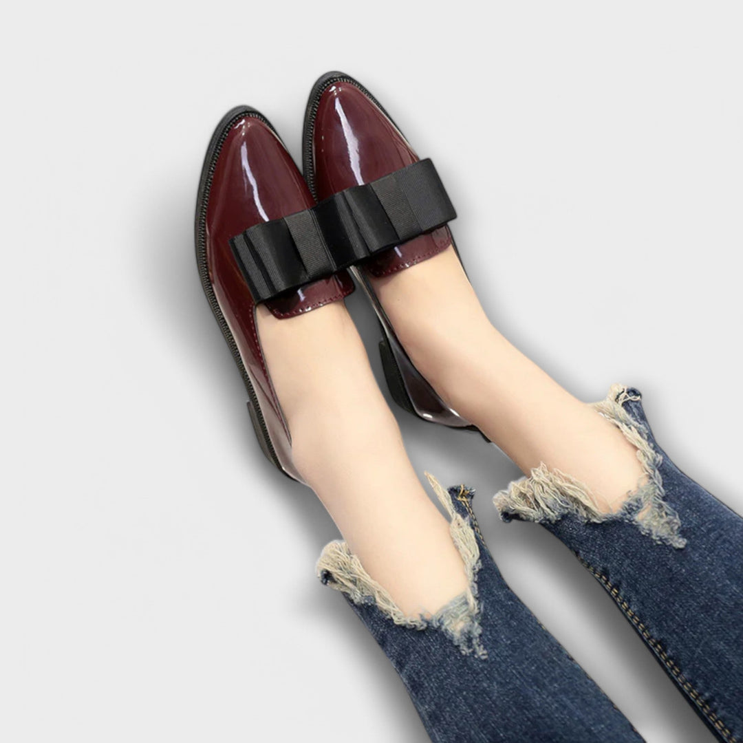 A woman wearing refined classic loafers with a smart everyday outfit