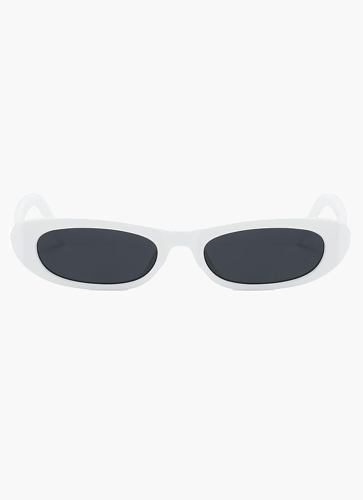 A woman wearing retro black oval cat-eye sunglasses on a sunny day.