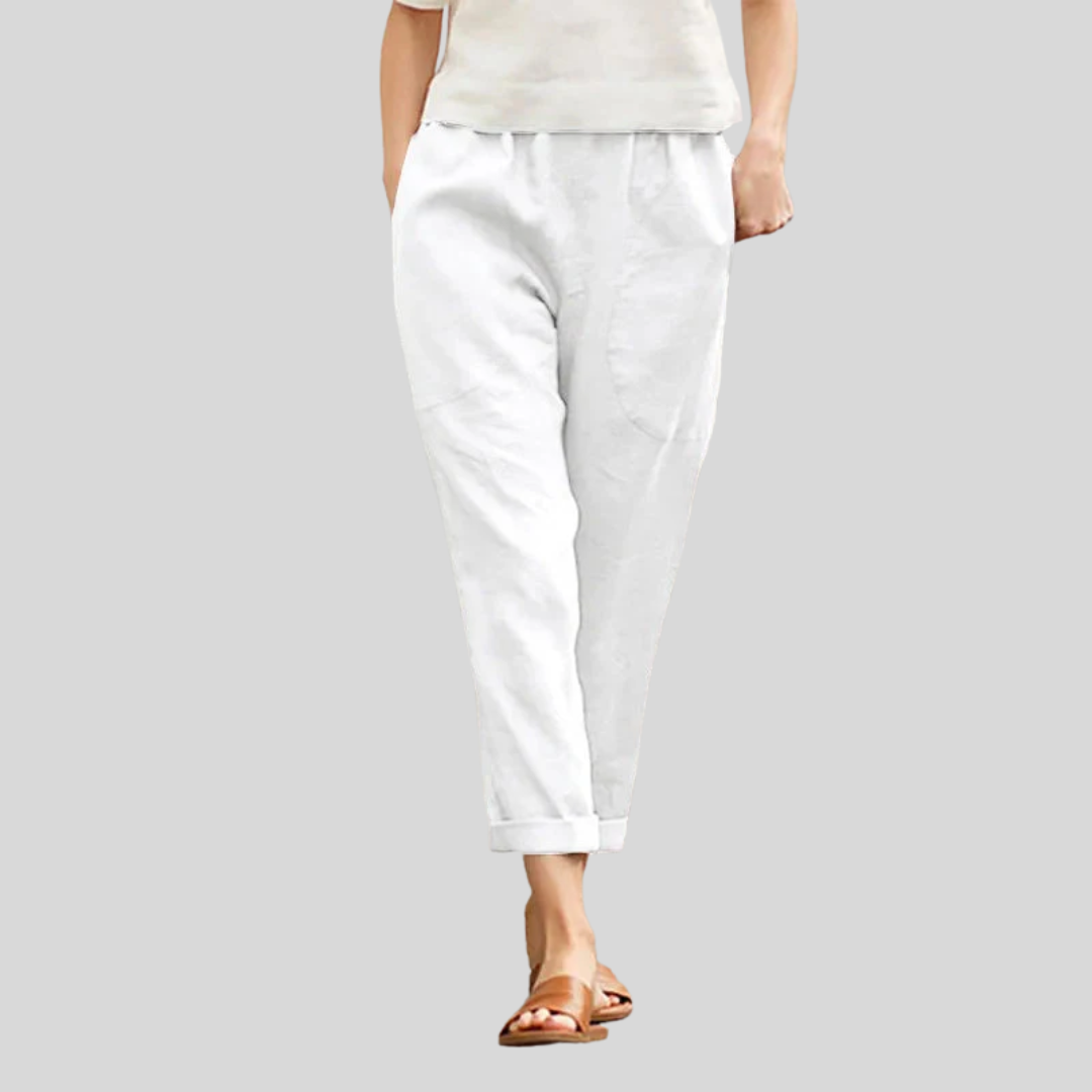A woman wearing wide relaxed pants with two roomy pockets and an elastic waist.
