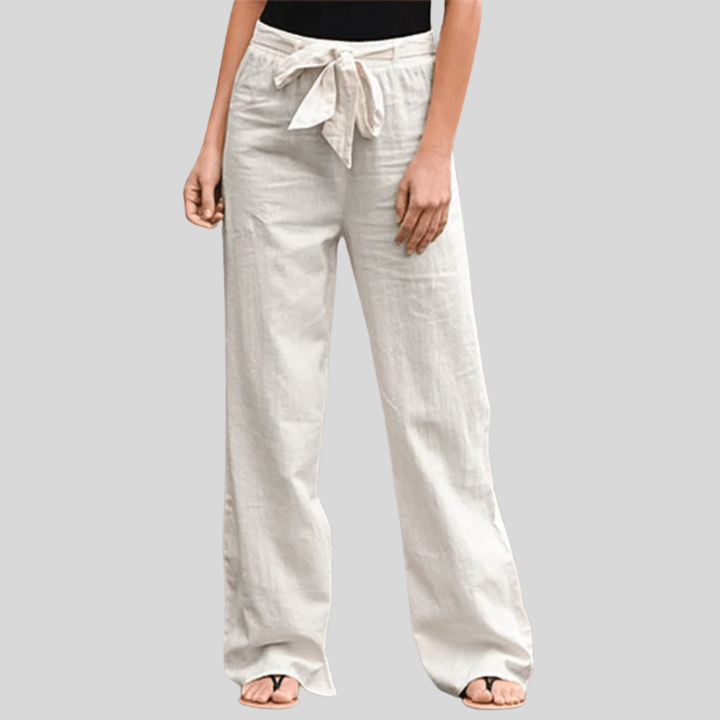Woman wearing relaxed drawcord-waist pants with a smart top, out for the day.