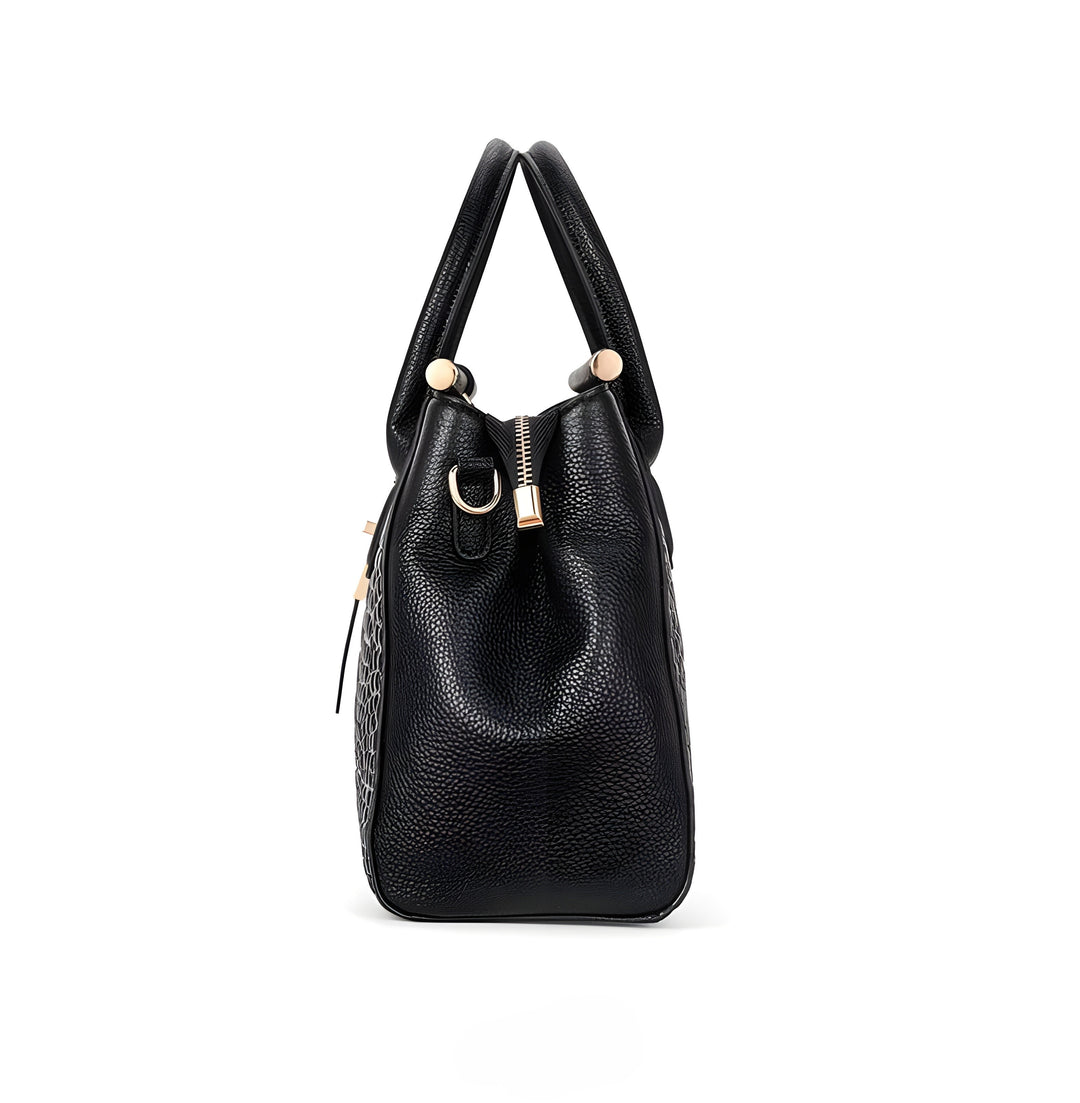 A woman carrying an elegant classic handbag on her arm as she heads out for the day.