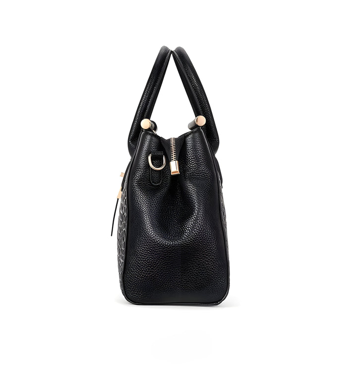 A woman carrying an elegant classic handbag on her arm as she heads out for the day.