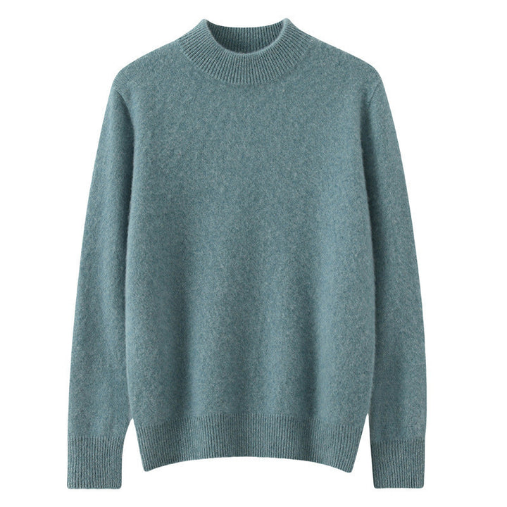 A woman wearing a soft luxe crew neck sweater with a matte finish, styled with smart pants.
