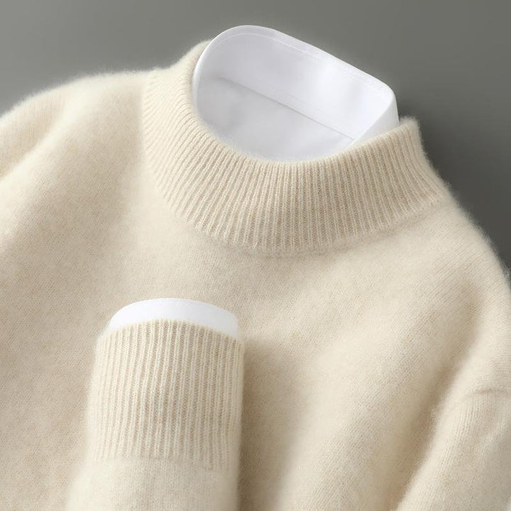 A woman wearing a soft luxe crew neck sweater with a matte finish, styled with smart pants.