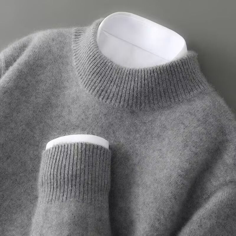 A woman wearing a soft luxe crew neck sweater with a matte finish, styled with smart pants.