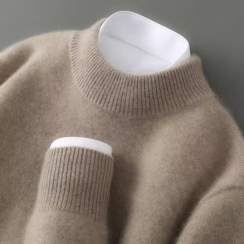 A woman wearing a soft luxe crew neck sweater with a matte finish, styled with smart pants.