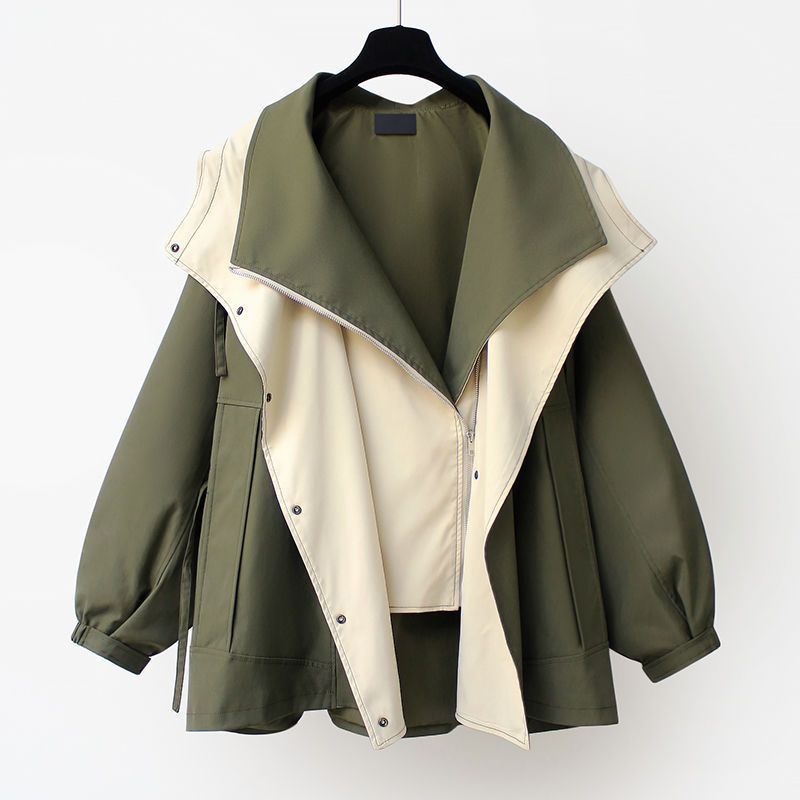 A woman wearing a lightweight weatherproof jacket with an adjustable hem on a blustery day.