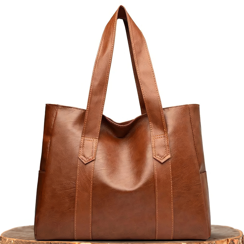 A woman carrying a classic elegant bag with a rich finish over her shoulder
