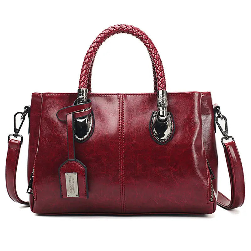 A woman carrying a versatile structured handbag on her shoulder while out in town.