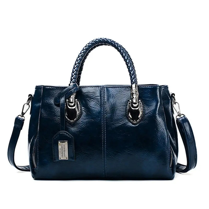 A woman carrying a versatile structured handbag on her shoulder while out in town.