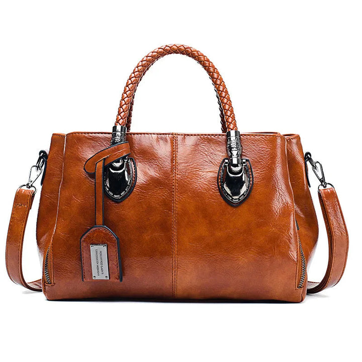 A woman carrying a versatile structured handbag on her shoulder while out in town.