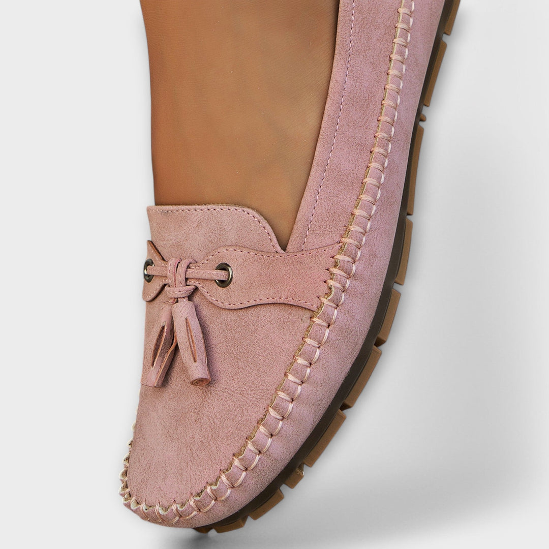 A woman wearing classic loafers on an easy day in town.