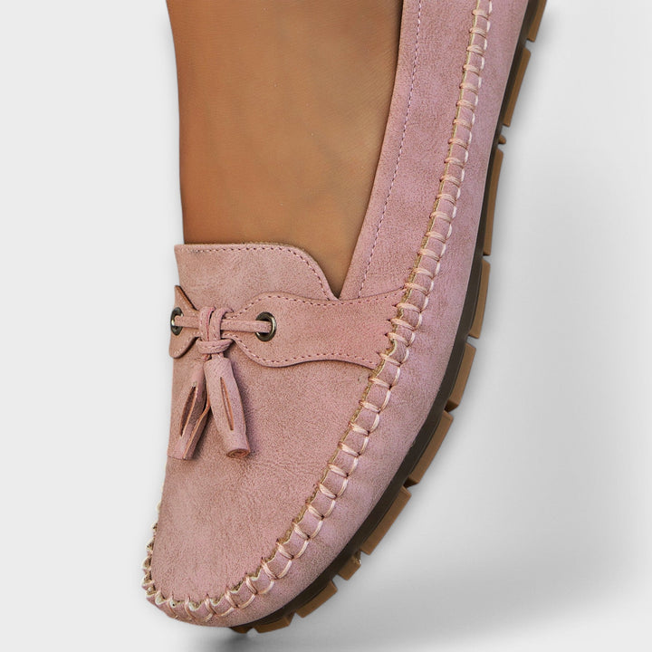 A woman wearing classic loafers on an easy day in town.