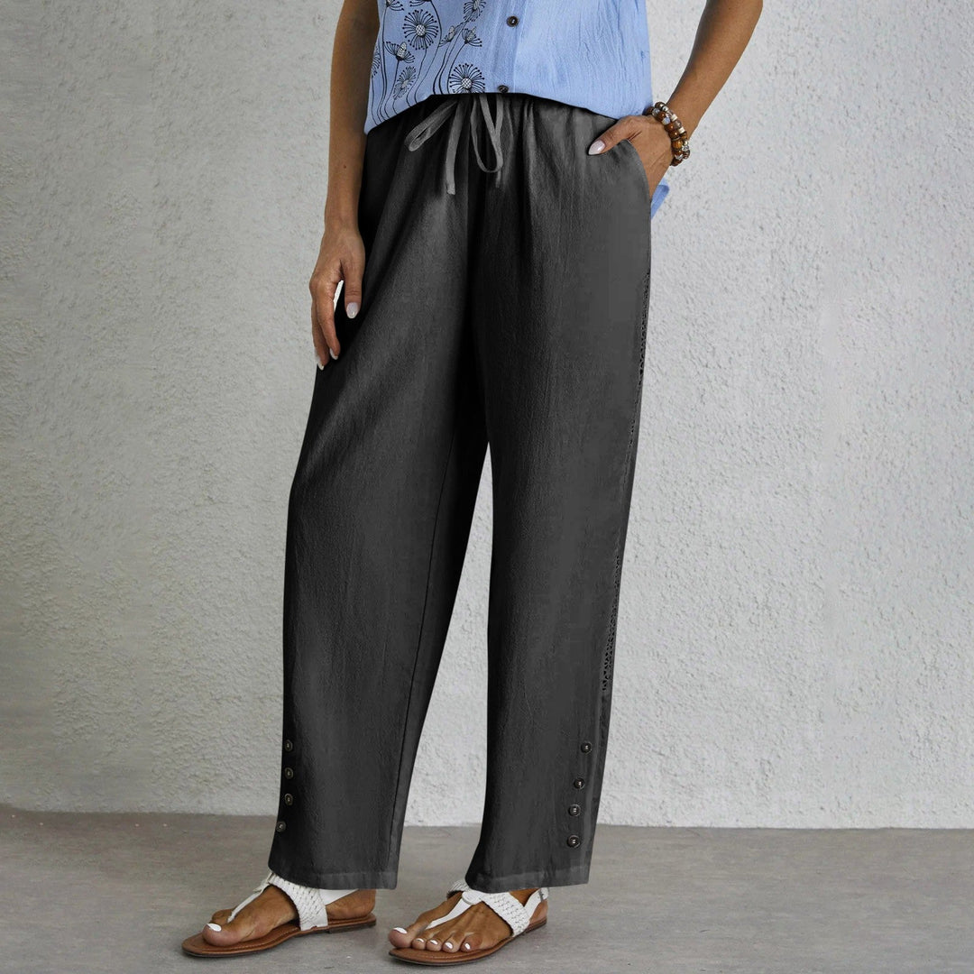 Woman wearing relaxed button-detail pants with a simple top, out for the day.