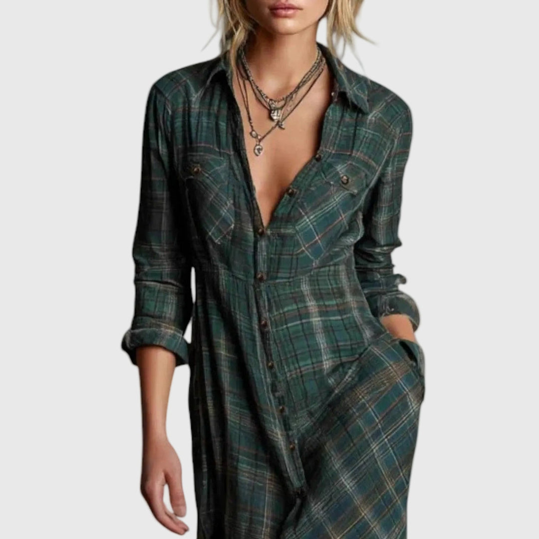Woman wearing a long green check button-through maxi shirt dress with a collar and pockets, styled with boots.