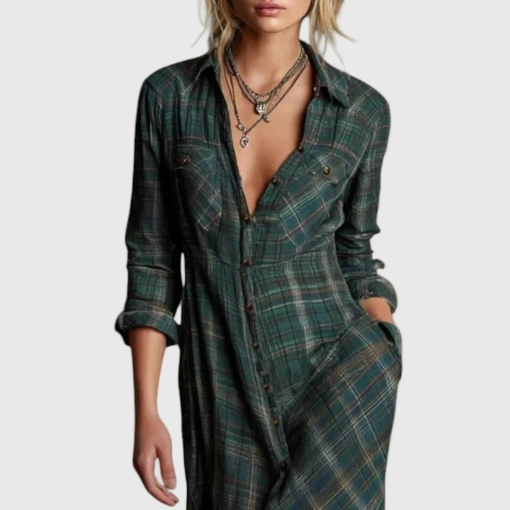 Woman wearing a long green check button-through maxi shirt dress with a collar and pockets, styled with boots.