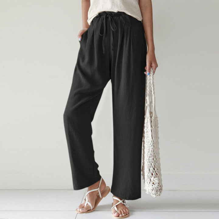 A woman walking outdoors in relaxed drawstring pants with an easy, comfortable everyday look.