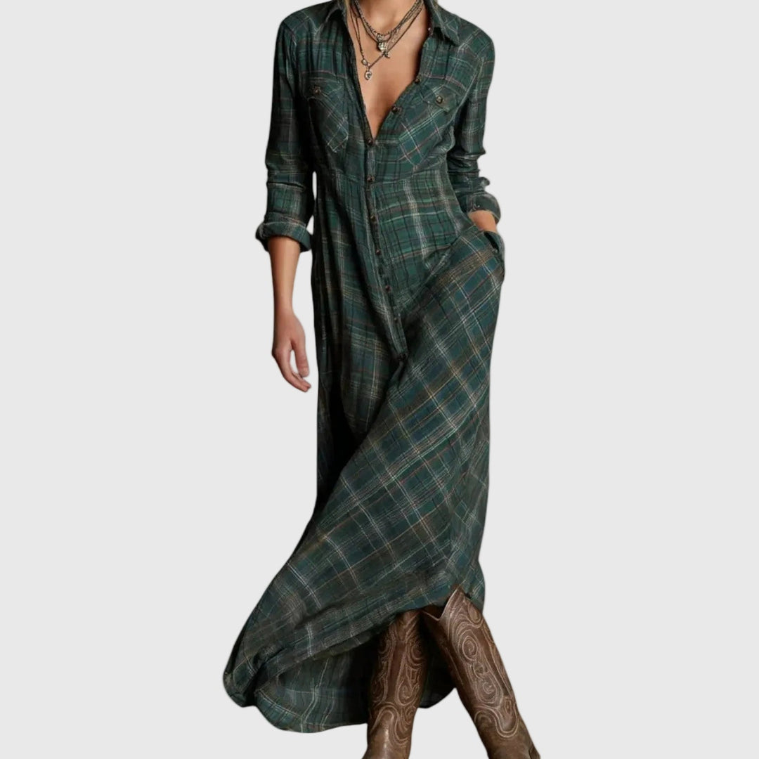 Woman wearing a long green check button-through maxi shirt dress with a collar and pockets, styled with boots.