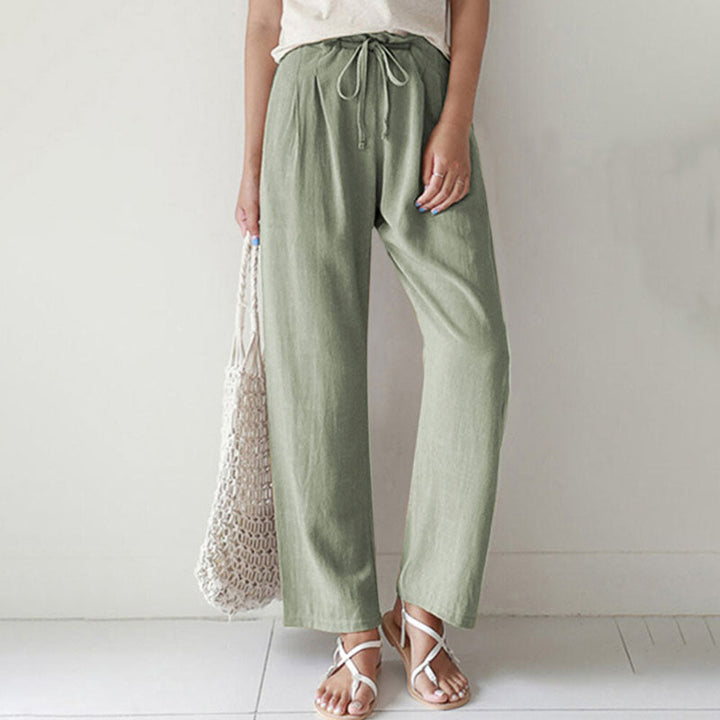 A woman walking outdoors in relaxed drawstring pants with an easy, comfortable everyday look.