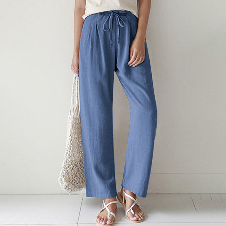 A woman walking outdoors in relaxed drawstring pants with an easy, comfortable everyday look.