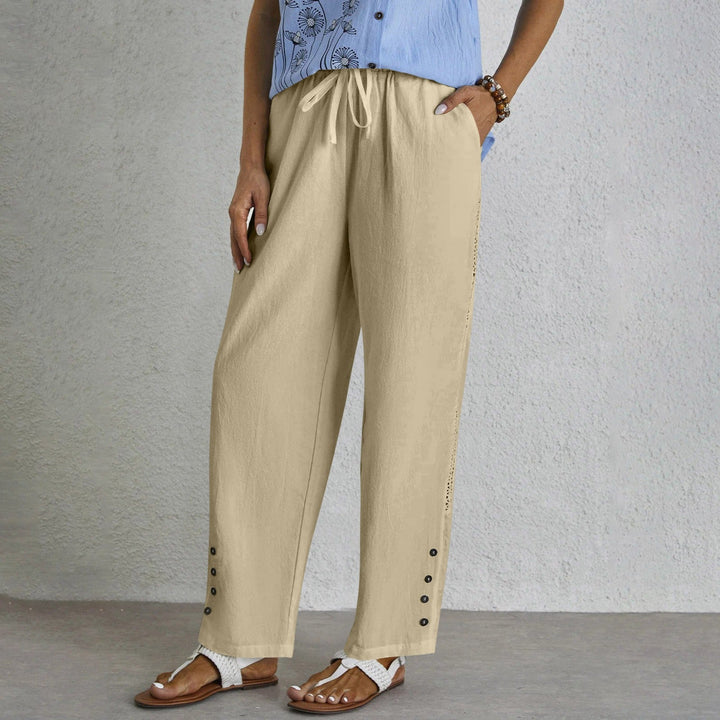 Woman wearing relaxed button-detail pants with a simple top, out for the day.