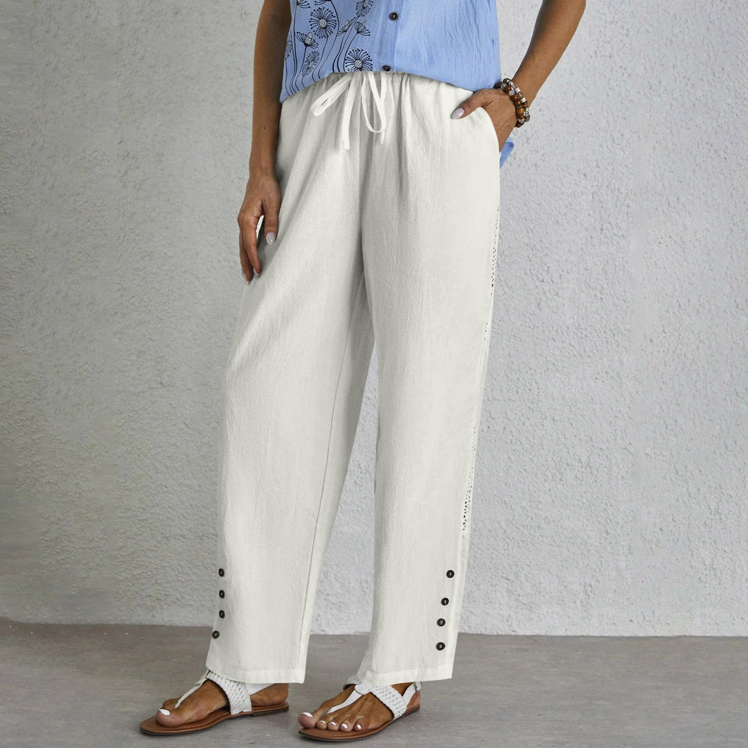 Woman wearing relaxed button-detail pants with a simple top, out for the day.