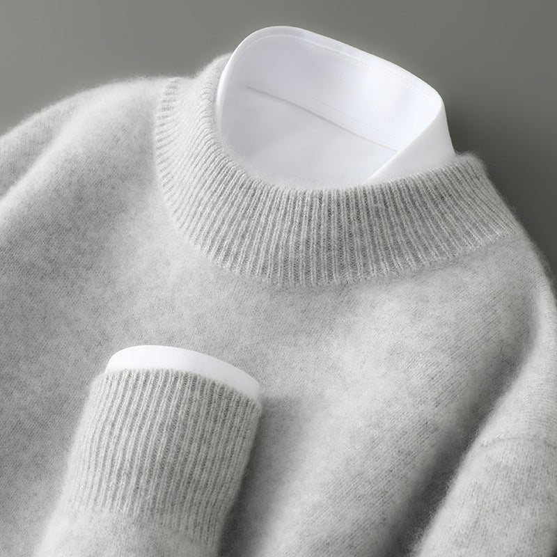A woman wearing a soft luxe crew neck sweater with a matte finish, styled with smart pants.