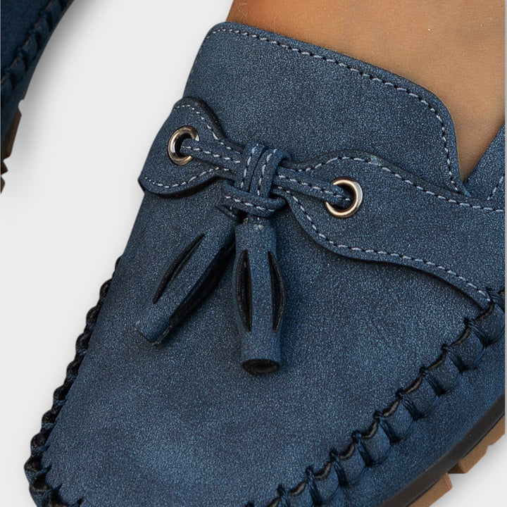 A woman wearing classic loafers on an easy day in town.