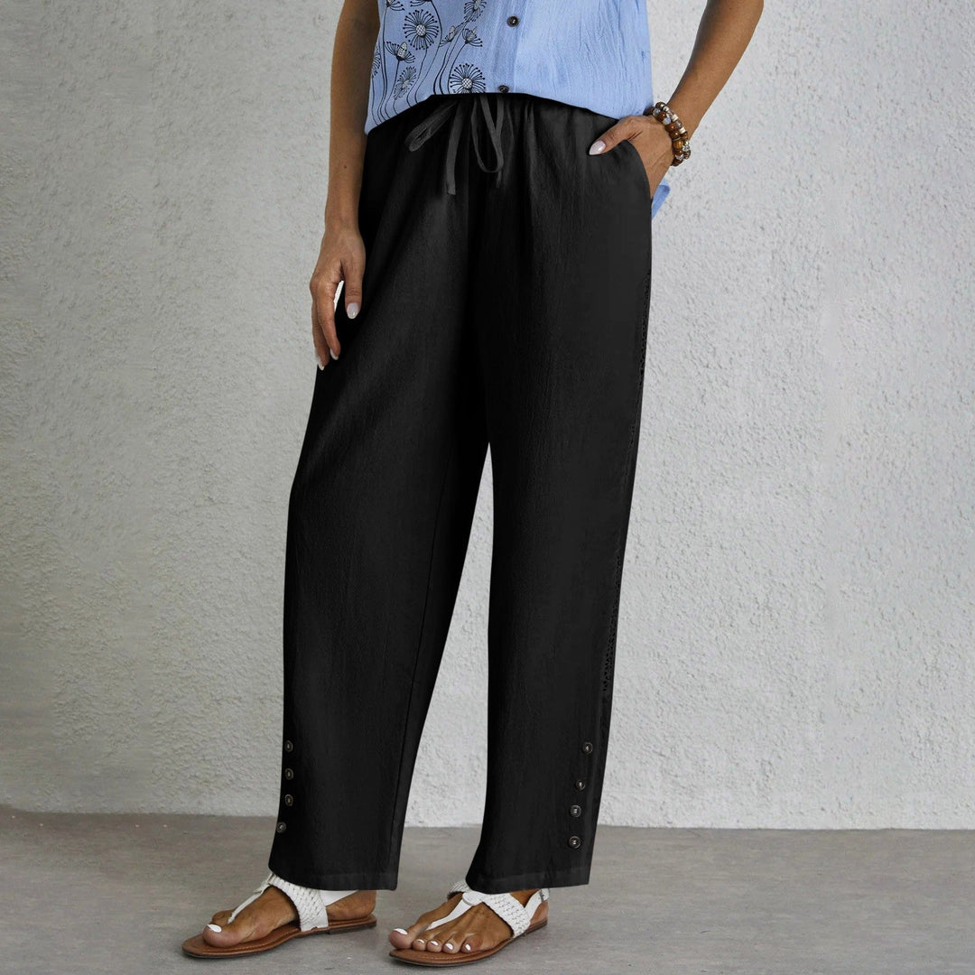 Woman wearing relaxed button-detail pants with a simple top, out for the day.