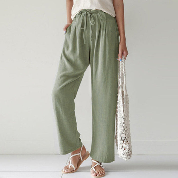 A woman walking outdoors in relaxed drawstring pants with an easy, comfortable everyday look.