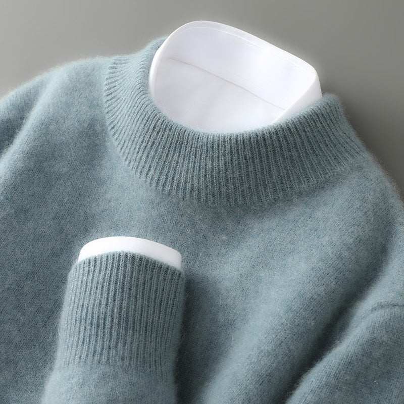 A woman wearing a soft luxe crew neck sweater with a matte finish, styled with smart pants.