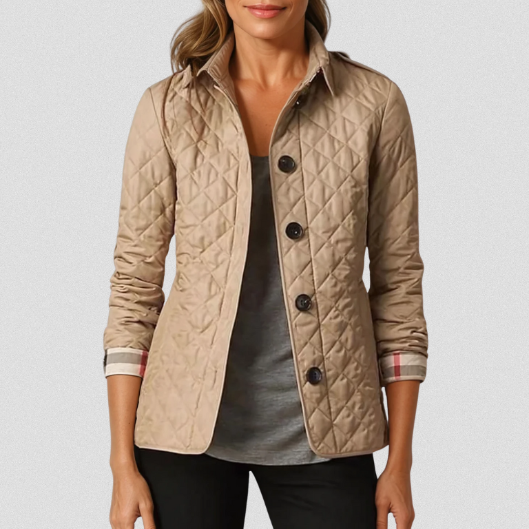 A woman wearing an fall jacket over a top, layered for a crisp day in town.