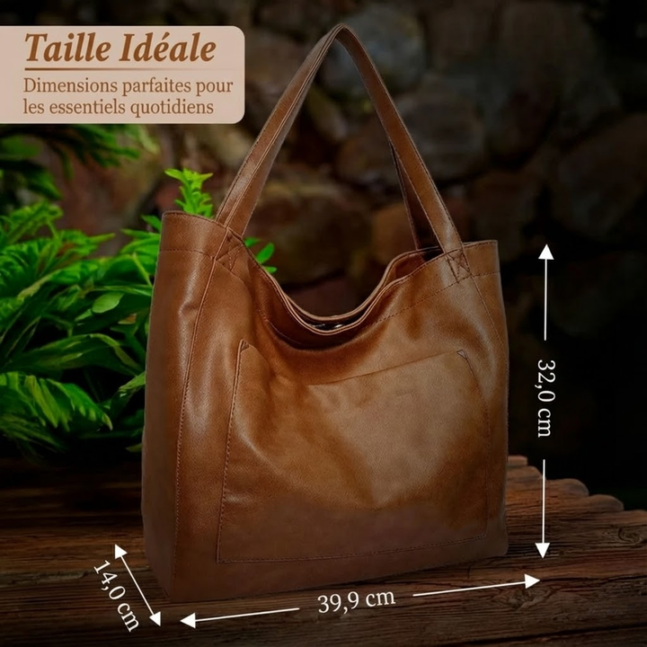 A woman wearing a vintage-style shoulder bag while walking through a weekend market.