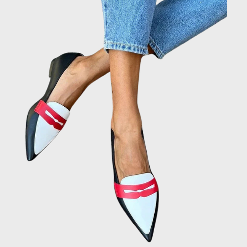 A woman wearing classic slip-on loafers, styled for an easy everyday look.