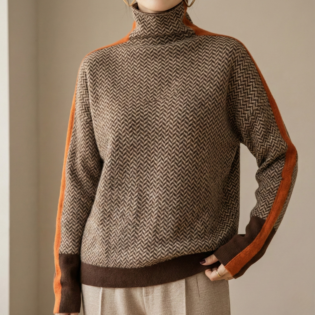 A woman wearing a brown and beige chevron high-collar sweater with bright green side stripes.