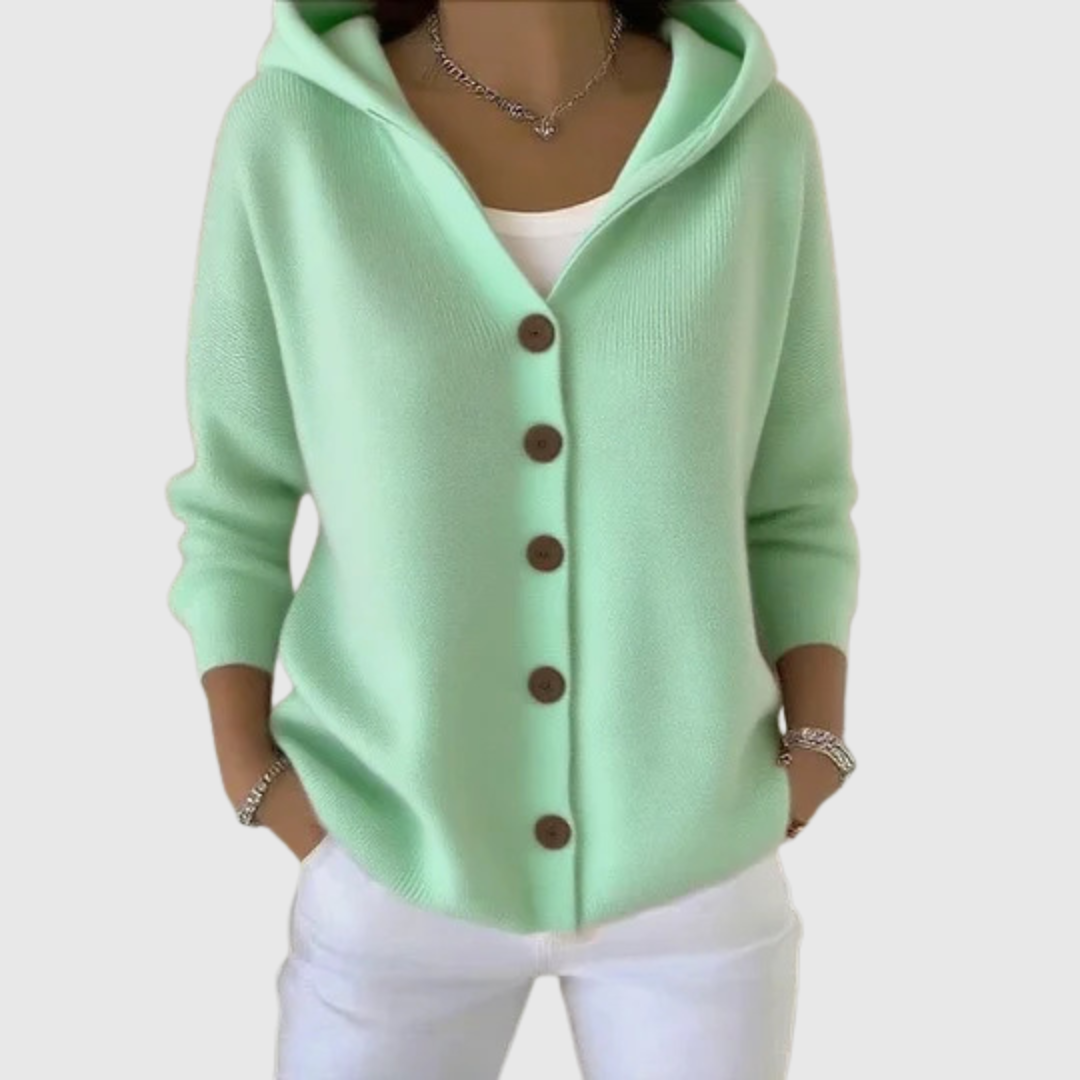 A woman wearing a hooded button cardigan open over a top for a relaxed everyday look.