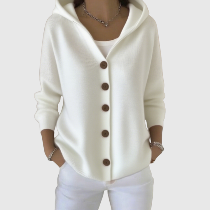 A woman wearing a hooded button cardigan open over a top for a relaxed everyday look.