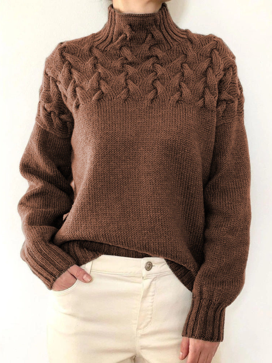 A woman wearing a warm roll-neck sweater, cosy and elegant on a cold winter day.